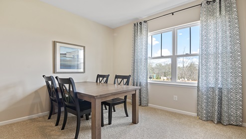 Bedroom with carpet and window.