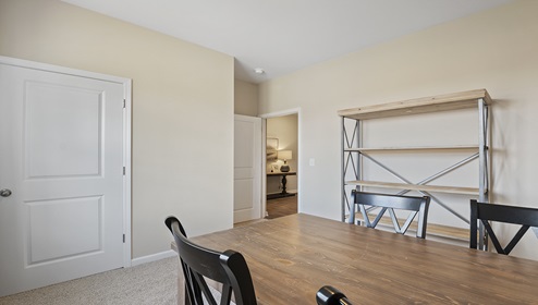 Bedroom with carpet and window.