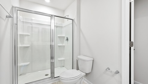 Bathroom with walk in shower.