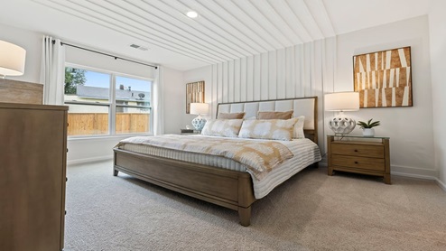 Bedroom with carpet and window.