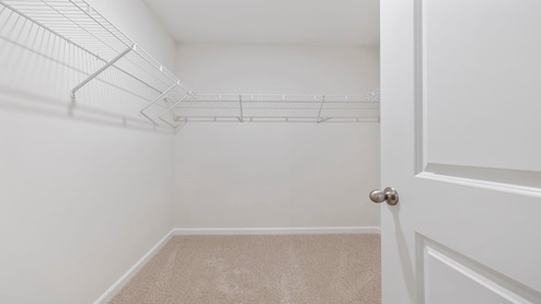 Closet with hanging storage racks.