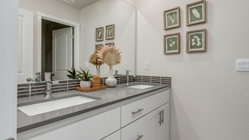 Misty Meadows secondary bathroom with vanity and mirror