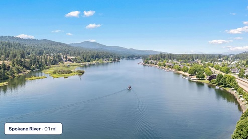 A drone shot of the Spokane River down the street from Grand Mill Townhomes