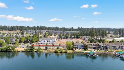 A drone shot of the Spokane River across the street from Grand Mill Townhomes
