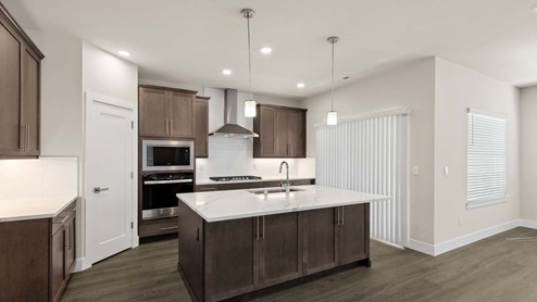 Rainier floor plan kitchen with sliding door access to rear patio