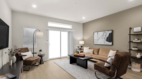 living room with laminate flooring sliding glass door to balcony and transom window