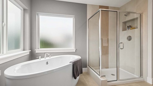 Alternate view Primary bathroom featuring beautiful, oversized shower and modern soaking tub