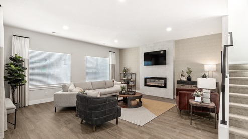 beautiful and spacious living room with modern electric fireplace