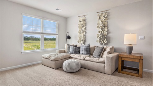 Loft area with carpet flooring