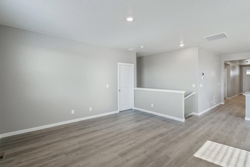 open concept iving room with hallway view