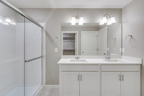 main bathroom with white cabinet