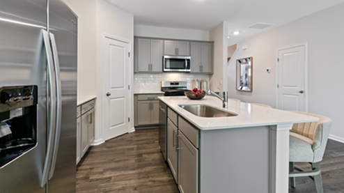 modern kitchen featuring light grey cabinetry, and stainless steel appliances