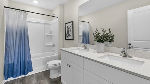 Bathroom with white cabinets