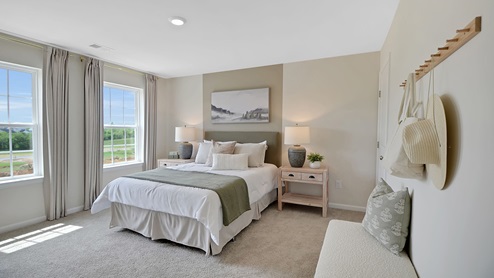 Different view of the bedroom with two single windows.