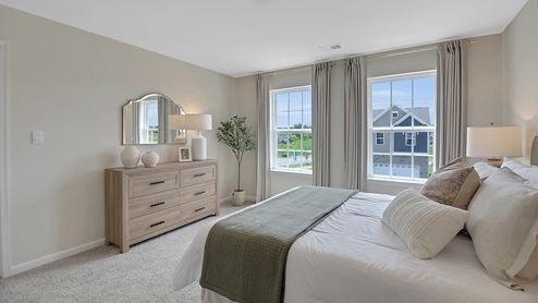 Bedroom with two single windows.