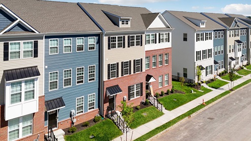 An aerial view of a three-story townhome building with 5 units.