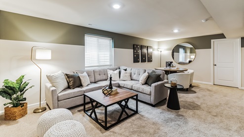 Wide frame view of the loft living room an dining area.