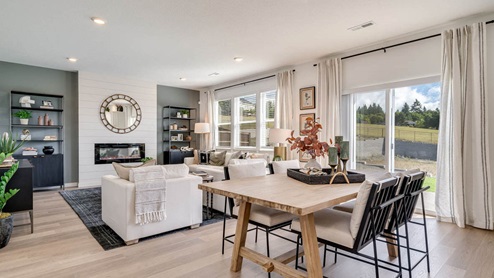 Great room with laminate flooring and an electric fireplace
