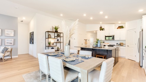 Dining area with a sliding glass door to a fenced backyard