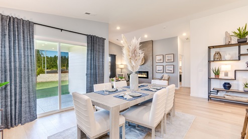 Dining area with a sliding glass door to a fenced backyard