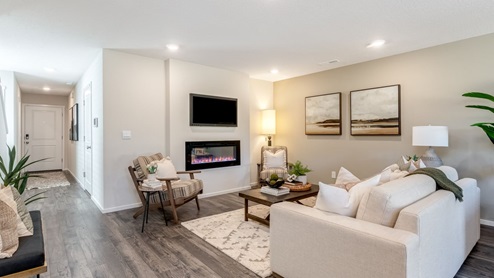 Great room with laminate flooring and an electric fireplace
