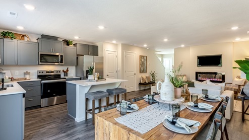 Dining area with a sliding glass door to a fenced backyard