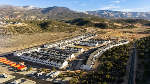 High Aerial photo of the Old Sorrel community by D.R. Horton and the surrounding mountain scape in Cedar City Utah.