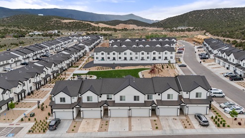High Aerial photo of the Old Sorrel community by D.R. Horton and the surrounding mountain scape in Cedar City Utah.