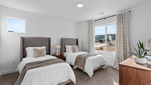 Secondary bedroom with one large window.