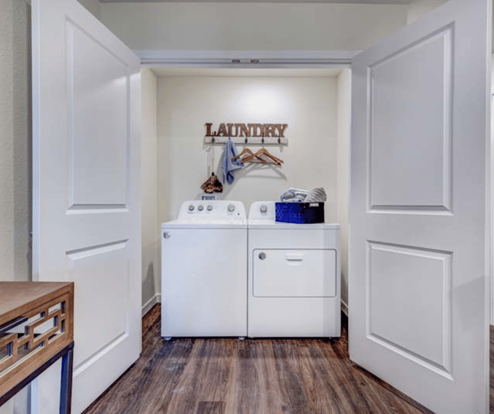 upstairs laundry room with full washer and dryer