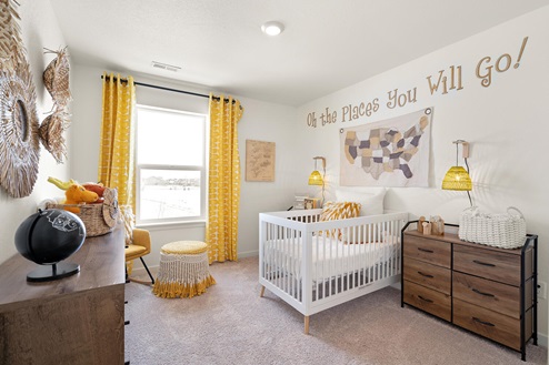 spacious bedroom with nursery set-up and decor