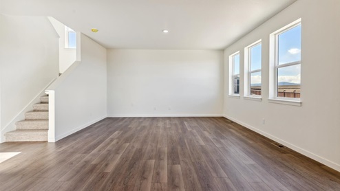 living room with windows and hard wood floor