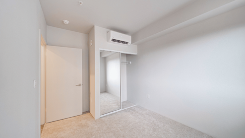 Interior bedroom with full length door mirrors