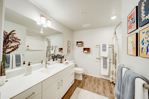 Interior bathroom with two sinks and full size shower