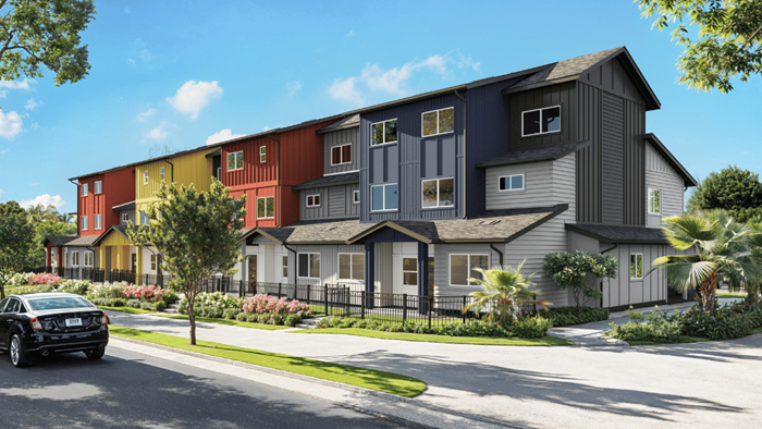 Exterior three story building with yellow and red wood cladding