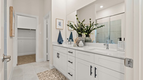 Bathroom with white cabinets and vanity