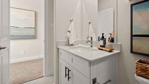 Secondary bathroom with white vanity