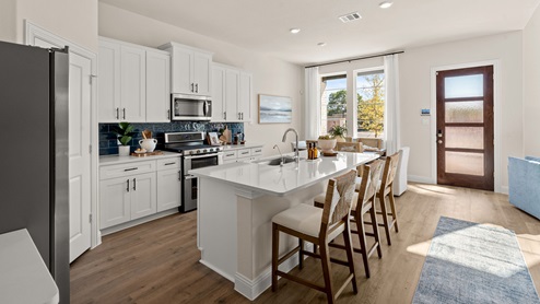 Kitchen with island and white cabinets