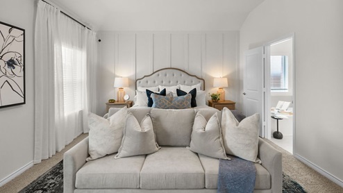 Interior primary bedroom with windows