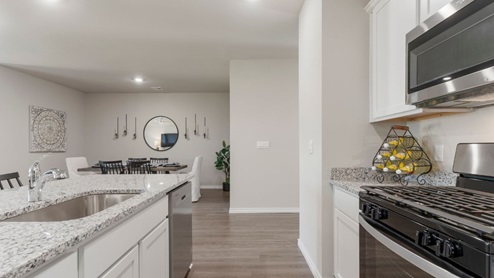 Welcome to The Estates at Conrad Village community in Bixby, Oklahoma, where the Justin floor plan embodies the perfect blend of modern design and small-town charm. As you explore the streets lined with brick or brick and rock exterior elevations, you'll feel a sense of belonging in this welcoming neighborhood. The Justin offers 1831 square feet of spacious living space, featuring 4 bedrooms and 2 bathrooms, designed to accommodate the needs of your family. Step inside and be greeted by an inviting open-concept layout, where the kitchen seamlessly overlooks the combination living and dining area. Designed with both style and functionality in mind, the kitchen boasts painted cabinetry, granite countertops, and luxury vinyl wood flooring. Large windows in the living room flood the space with natural light, creating a warm and inviting atmosphere. Stainless steel appliances add a touch of sophistication to the heart of the home. Indulge in the luxurious 12x24 marble tile surround in both the primary and secondary bathrooms, creating a spa-like retreat for your daily routines. With carpeted floors in the bedrooms, comfort is never compromised. Retreat to the primary bedroom, where relaxation awaits. Enjoy the convenience of an attached bathroom with a walk-in closet, double vanity, and a separate toilet for added privacy. Experience the convenience of smart home features throughout the Justin floor plan, adding modern technology to your everyday life. Don't miss your chance to make the Justin your new home in The Estates at Conrad Village community. Contact us today to schedule a tour and discover why this floor plan is the perfect combination of style, comfort, and functionality for your family's needs. Your dream home awaits!
