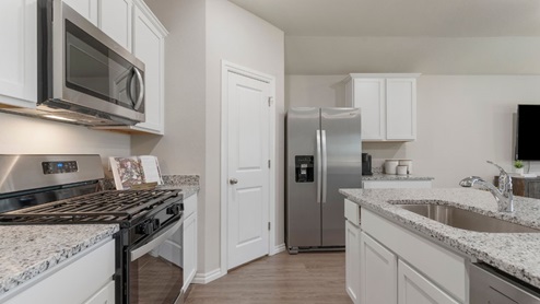 Welcome to The Estates at Conrad Village community in Bixby, Oklahoma, where the Justin floor plan embodies the perfect blend of modern design and small-town charm. As you explore the streets lined with brick or brick and rock exterior elevations, you'll feel a sense of belonging in this welcoming neighborhood. The Justin offers 1831 square feet of spacious living space, featuring 4 bedrooms and 2 bathrooms, designed to accommodate the needs of your family. Step inside and be greeted by an inviting open-concept layout, where the kitchen seamlessly overlooks the combination living and dining area. Designed with both style and functionality in mind, the kitchen boasts painted cabinetry, granite countertops, and luxury vinyl wood flooring. Large windows in the living room flood the space with natural light, creating a warm and inviting atmosphere. Stainless steel appliances add a touch of sophistication to the heart of the home. Indulge in the luxurious 12x24 marble tile surround in both the primary and secondary bathrooms, creating a spa-like retreat for your daily routines. With carpeted floors in the bedrooms, comfort is never compromised. Retreat to the primary bedroom, where relaxation awaits. Enjoy the convenience of an attached bathroom with a walk-in closet, double vanity, and a separate toilet for added privacy. Experience the convenience of smart home features throughout the Justin floor plan, adding modern technology to your everyday life. Don't miss your chance to make the Justin your new home in The Estates at Conrad Village community. Contact us today to schedule a tour and discover why this floor plan is the perfect combination of style, comfort, and functionality for your family's needs. Your dream home awaits!