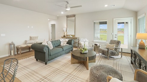 Interior of living room with large windows and back door