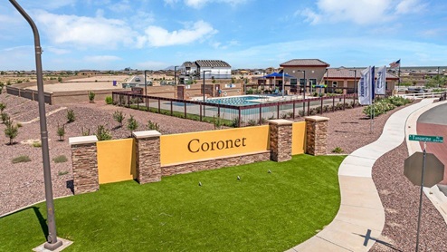 Discover new homes within the only gated community in Gladden Farms. Coronet at Gladden Farms, a premier D.R. Horton community where modern living meets the scenic charm of Marana, Arizona. Located within the expansive Gladden Farms master-planned neighborhood, Coronet offers residents the perfect blend of small-town warmth and modern amenities. Surrounded by 830 acres of green space, 28 parks, and 19 playgrounds, this gated community is designed for families who value both comfort and outdoor adventure. Residents of Coronet at Gladden Farms enjoy exclusive amenities such as a sparkling community pool, jacuzzi, fitness center, and a clubhouse complete with a BBQ area and patio. The gated community also offers walking trails, a dog park, and playgrounds, making it the ideal environment for families and active lifestyles. Each home is thoughtfully designed with high-end finishes, including quartz countertops, wood-look luxury vinyl plank flooring, tile roofs, Spanish Lace stucco exteriors and beautifully landscaped front yards with auto drip irrigation. Additionally, all homes feature covered front porches and back patios, perfect for enjoying the stunning Arizona sunsets and monsoons. Coronet at Gladden Farms is built with a commitment to energy efficiency and sustainability. Each home meets the DOE Zero Energy Ready Home standards, meaning they are constructed to be so energy-efficient that a renewable energy system could offset most or all of the home's annual energy use. These homes include advanced features such as tankless water heaters, energy-efficient LED lighting, and high-performance insulation, ensuring lower utility costs and a reduced environmental footprint. The Home is Connected Smart Home package, which includes a smart thermostat, video doorbell, keyless entry, a Wi-Fi-enabled garage door opener, and much more, provides modern convenience and enhanced security. Living in Coronet at Gladden Farms means being part of a thriving community with easy access to shopping, dining, and recreation. The greater Gladden Farms area is equipped with amenities like a splashpad, soccer fields, and the Paws & Claws Dog Park. With the new Fry’s Marketplace, along with Starbucks and Ace Hardware, all your daily needs are just moments away. Families will appreciate being part of the Marana Unified School District, with Gladden Farms Elementary nearby and a new K-8 school opening in 2025. Beyond the community, residents can explore the natural beauty of the area with proximity to Picacho Peak State Park, Tortolita Mountain Park, and Saguaro National Park, offering endless opportunities for hiking, cycling, and wildlife viewing. Major employers such as Davis-Monthan Air Force Base, Raytheon, and Ventana Medical Systems are just a short drive away, making Coronet at Gladden Farms an ideal location for those commuting to Tucson, Casa Grande, or Phoenix. Experience the perfect blend of comfort, convenience, and community at Coronet at Gladden Farms—where new homes, energy efficiency, and a vibrant lifestyle await.