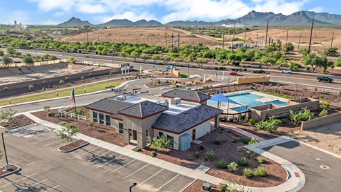 Discover new homes within the only gated community in Gladden Farms. Coronet at Gladden Farms, a premier D.R. Horton community where modern living meets the scenic charm of Marana, Arizona. Located within the expansive Gladden Farms master-planned neighborhood, Coronet offers residents the perfect blend of small-town warmth and modern amenities. Surrounded by 830 acres of green space, 28 parks, and 19 playgrounds, this gated community is designed for families who value both comfort and outdoor adventure. Residents of Coronet at Gladden Farms enjoy exclusive amenities such as a sparkling community pool, jacuzzi, fitness center, and a clubhouse complete with a BBQ area and patio. The gated community also offers walking trails, a dog park, and playgrounds, making it the ideal environment for families and active lifestyles. Each home is thoughtfully designed with high-end finishes, including quartz countertops, wood-look luxury vinyl plank flooring, tile roofs, Spanish Lace stucco exteriors and beautifully landscaped front yards with auto drip irrigation. Additionally, all homes feature covered front porches and back patios, perfect for enjoying the stunning Arizona sunsets and monsoons. Coronet at Gladden Farms is built with a commitment to energy efficiency and sustainability. Each home meets the DOE Zero Energy Ready Home standards, meaning they are constructed to be so energy-efficient that a renewable energy system could offset most or all of the home's annual energy use. These homes include advanced features such as tankless water heaters, energy-efficient LED lighting, and high-performance insulation, ensuring lower utility costs and a reduced environmental footprint. The Home is Connected Smart Home package, which includes a smart thermostat, video doorbell, keyless entry, a Wi-Fi-enabled garage door opener, and much more, provides modern convenience and enhanced security. Living in Coronet at Gladden Farms means being part of a thriving community with easy access to shopping, dining, and recreation. The greater Gladden Farms area is equipped with amenities like a splashpad, soccer fields, and the Paws & Claws Dog Park. With the new Fry’s Marketplace, along with Starbucks and Ace Hardware, all your daily needs are just moments away. Families will appreciate being part of the Marana Unified School District, with Gladden Farms Elementary nearby and a new K-8 school opening in 2025. Beyond the community, residents can explore the natural beauty of the area with proximity to Picacho Peak State Park, Tortolita Mountain Park, and Saguaro National Park, offering endless opportunities for hiking, cycling, and wildlife viewing. Major employers such as Davis-Monthan Air Force Base, Raytheon, and Ventana Medical Systems are just a short drive away, making Coronet at Gladden Farms an ideal location for those commuting to Tucson, Casa Grande, or Phoenix. Experience the perfect blend of comfort, convenience, and community at Coronet at Gladden Farms—where new homes, energy efficiency, and a vibrant lifestyle await.