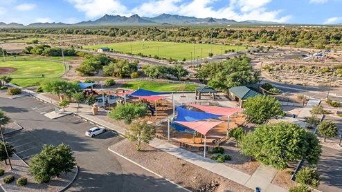 Discover new homes within the only gated community in Gladden Farms. Coronet at Gladden Farms, a premier D.R. Horton community where modern living meets the scenic charm of Marana, Arizona. Located within the expansive Gladden Farms master-planned neighborhood, Coronet offers residents the perfect blend of small-town warmth and modern amenities. Surrounded by 830 acres of green space, 28 parks, and 19 playgrounds, this gated community is designed for families who value both comfort and outdoor adventure. Residents of Coronet at Gladden Farms enjoy exclusive amenities such as a sparkling community pool, jacuzzi, fitness center, and a clubhouse complete with a BBQ area and patio. The gated community also offers walking trails, a dog park, and playgrounds, making it the ideal environment for families and active lifestyles. Each home is thoughtfully designed with high-end finishes, including quartz countertops, wood-look luxury vinyl plank flooring, tile roofs, Spanish Lace stucco exteriors and beautifully landscaped front yards with auto drip irrigation. Additionally, all homes feature covered front porches and back patios, perfect for enjoying the stunning Arizona sunsets and monsoons. Coronet at Gladden Farms is built with a commitment to energy efficiency and sustainability. Each home meets the DOE Zero Energy Ready Home standards, meaning they are constructed to be so energy-efficient that a renewable energy system could offset most or all of the home's annual energy use. These homes include advanced features such as tankless water heaters, energy-efficient LED lighting, and high-performance insulation, ensuring lower utility costs and a reduced environmental footprint. The Home is Connected Smart Home package, which includes a smart thermostat, video doorbell, keyless entry, a Wi-Fi-enabled garage door opener, and much more, provides modern convenience and enhanced security. Living in Coronet at Gladden Farms means being part of a thriving community with easy access to shopping, dining, and recreation. The greater Gladden Farms area is equipped with amenities like a splashpad, soccer fields, and the Paws & Claws Dog Park. With the new Fry’s Marketplace, along with Starbucks and Ace Hardware, all your daily needs are just moments away. Families will appreciate being part of the Marana Unified School District, with Gladden Farms Elementary nearby and a new K-8 school opening in 2025. Beyond the community, residents can explore the natural beauty of the area with proximity to Picacho Peak State Park, Tortolita Mountain Park, and Saguaro National Park, offering endless opportunities for hiking, cycling, and wildlife viewing. Major employers such as Davis-Monthan Air Force Base, Raytheon, and Ventana Medical Systems are just a short drive away, making Coronet at Gladden Farms an ideal location for those commuting to Tucson, Casa Grande, or Phoenix. Experience the perfect blend of comfort, convenience, and community at Coronet at Gladden Farms—where new homes, energy efficiency, and a vibrant lifestyle await.