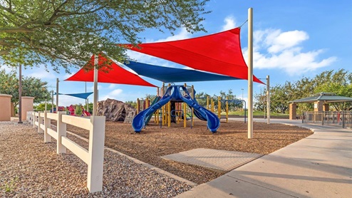 Discover new homes within the only gated community in Gladden Farms. Coronet at Gladden Farms, a premier D.R. Horton community where modern living meets the scenic charm of Marana, Arizona. Located within the expansive Gladden Farms master-planned neighborhood, Coronet offers residents the perfect blend of small-town warmth and modern amenities. Surrounded by 830 acres of green space, 28 parks, and 19 playgrounds, this gated community is designed for families who value both comfort and outdoor adventure. Residents of Coronet at Gladden Farms enjoy exclusive amenities such as a sparkling community pool, jacuzzi, fitness center, and a clubhouse complete with a BBQ area and patio. The gated community also offers walking trails, a dog park, and playgrounds, making it the ideal environment for families and active lifestyles. Each home is thoughtfully designed with high-end finishes, including quartz countertops, wood-look luxury vinyl plank flooring, tile roofs, Spanish Lace stucco exteriors and beautifully landscaped front yards with auto drip irrigation. Additionally, all homes feature covered front porches and back patios, perfect for enjoying the stunning Arizona sunsets and monsoons. Coronet at Gladden Farms is built with a commitment to energy efficiency and sustainability. Each home meets the DOE Zero Energy Ready Home standards, meaning they are constructed to be so energy-efficient that a renewable energy system could offset most or all of the home's annual energy use. These homes include advanced features such as tankless water heaters, energy-efficient LED lighting, and high-performance insulation, ensuring lower utility costs and a reduced environmental footprint. The Home is Connected Smart Home package, which includes a smart thermostat, video doorbell, keyless entry, a Wi-Fi-enabled garage door opener, and much more, provides modern convenience and enhanced security. Living in Coronet at Gladden Farms means being part of a thriving community with easy access to shopping, dining, and recreation. The greater Gladden Farms area is equipped with amenities like a splashpad, soccer fields, and the Paws & Claws Dog Park. With the new Fry’s Marketplace, along with Starbucks and Ace Hardware, all your daily needs are just moments away. Families will appreciate being part of the Marana Unified School District, with Gladden Farms Elementary nearby and a new K-8 school opening in 2025. Beyond the community, residents can explore the natural beauty of the area with proximity to Picacho Peak State Park, Tortolita Mountain Park, and Saguaro National Park, offering endless opportunities for hiking, cycling, and wildlife viewing. Major employers such as Davis-Monthan Air Force Base, Raytheon, and Ventana Medical Systems are just a short drive away, making Coronet at Gladden Farms an ideal location for those commuting to Tucson, Casa Grande, or Phoenix. Experience the perfect blend of comfort, convenience, and community at Coronet at Gladden Farms—where new homes, energy efficiency, and a vibrant lifestyle await.