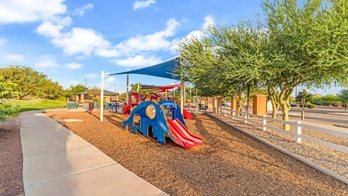 Discover new homes within the only gated community in Gladden Farms. Coronet at Gladden Farms, a premier D.R. Horton community where modern living meets the scenic charm of Marana, Arizona. Located within the expansive Gladden Farms master-planned neighborhood, Coronet offers residents the perfect blend of small-town warmth and modern amenities. Surrounded by 830 acres of green space, 28 parks, and 19 playgrounds, this gated community is designed for families who value both comfort and outdoor adventure. Residents of Coronet at Gladden Farms enjoy exclusive amenities such as a sparkling community pool, jacuzzi, fitness center, and a clubhouse complete with a BBQ area and patio. The gated community also offers walking trails, a dog park, and playgrounds, making it the ideal environment for families and active lifestyles. Each home is thoughtfully designed with high-end finishes, including quartz countertops, wood-look luxury vinyl plank flooring, tile roofs, Spanish Lace stucco exteriors and beautifully landscaped front yards with auto drip irrigation. Additionally, all homes feature covered front porches and back patios, perfect for enjoying the stunning Arizona sunsets and monsoons. Coronet at Gladden Farms is built with a commitment to energy efficiency and sustainability. Each home meets the DOE Zero Energy Ready Home standards, meaning they are constructed to be so energy-efficient that a renewable energy system could offset most or all of the home's annual energy use. These homes include advanced features such as tankless water heaters, energy-efficient LED lighting, and high-performance insulation, ensuring lower utility costs and a reduced environmental footprint. The Home is Connected Smart Home package, which includes a smart thermostat, video doorbell, keyless entry, a Wi-Fi-enabled garage door opener, and much more, provides modern convenience and enhanced security. Living in Coronet at Gladden Farms means being part of a thriving community with easy access to shopping, dining, and recreation. The greater Gladden Farms area is equipped with amenities like a splashpad, soccer fields, and the Paws & Claws Dog Park. With the new Fry’s Marketplace, along with Starbucks and Ace Hardware, all your daily needs are just moments away. Families will appreciate being part of the Marana Unified School District, with Gladden Farms Elementary nearby and a new K-8 school opening in 2025. Beyond the community, residents can explore the natural beauty of the area with proximity to Picacho Peak State Park, Tortolita Mountain Park, and Saguaro National Park, offering endless opportunities for hiking, cycling, and wildlife viewing. Major employers such as Davis-Monthan Air Force Base, Raytheon, and Ventana Medical Systems are just a short drive away, making Coronet at Gladden Farms an ideal location for those commuting to Tucson, Casa Grande, or Phoenix. Experience the perfect blend of comfort, convenience, and community at Coronet at Gladden Farms—where new homes, energy efficiency, and a vibrant lifestyle await.