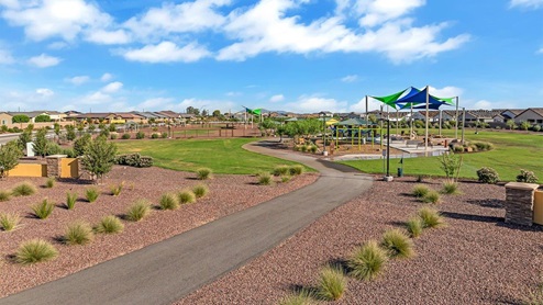 Discover new homes within the only gated community in Gladden Farms. Coronet at Gladden Farms, a premier D.R. Horton community where modern living meets the scenic charm of Marana, Arizona. Located within the expansive Gladden Farms master-planned neighborhood, Coronet offers residents the perfect blend of small-town warmth and modern amenities. Surrounded by 830 acres of green space, 28 parks, and 19 playgrounds, this gated community is designed for families who value both comfort and outdoor adventure. Residents of Coronet at Gladden Farms enjoy exclusive amenities such as a sparkling community pool, jacuzzi, fitness center, and a clubhouse complete with a BBQ area and patio. The gated community also offers walking trails, a dog park, and playgrounds, making it the ideal environment for families and active lifestyles. Each home is thoughtfully designed with high-end finishes, including quartz countertops, wood-look luxury vinyl plank flooring, tile roofs, Spanish Lace stucco exteriors and beautifully landscaped front yards with auto drip irrigation. Additionally, all homes feature covered front porches and back patios, perfect for enjoying the stunning Arizona sunsets and monsoons. Coronet at Gladden Farms is built with a commitment to energy efficiency and sustainability. Each home meets the DOE Zero Energy Ready Home standards, meaning they are constructed to be so energy-efficient that a renewable energy system could offset most or all of the home's annual energy use. These homes include advanced features such as tankless water heaters, energy-efficient LED lighting, and high-performance insulation, ensuring lower utility costs and a reduced environmental footprint. The Home is Connected Smart Home package, which includes a smart thermostat, video doorbell, keyless entry, a Wi-Fi-enabled garage door opener, and much more, provides modern convenience and enhanced security. Living in Coronet at Gladden Farms means being part of a thriving community with easy access to shopping, dining, and recreation. The greater Gladden Farms area is equipped with amenities like a splashpad, soccer fields, and the Paws & Claws Dog Park. With the new Fry’s Marketplace, along with Starbucks and Ace Hardware, all your daily needs are just moments away. Families will appreciate being part of the Marana Unified School District, with Gladden Farms Elementary nearby and a new K-8 school opening in 2025. Beyond the community, residents can explore the natural beauty of the area with proximity to Picacho Peak State Park, Tortolita Mountain Park, and Saguaro National Park, offering endless opportunities for hiking, cycling, and wildlife viewing. Major employers such as Davis-Monthan Air Force Base, Raytheon, and Ventana Medical Systems are just a short drive away, making Coronet at Gladden Farms an ideal location for those commuting to Tucson, Casa Grande, or Phoenix. Experience the perfect blend of comfort, convenience, and community at Coronet at Gladden Farms—where new homes, energy efficiency, and a vibrant lifestyle await.