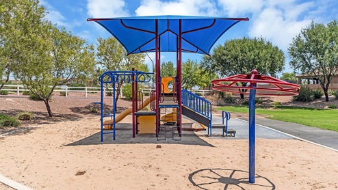Discover new homes within the only gated community in Gladden Farms. Coronet at Gladden Farms, a premier D.R. Horton community where modern living meets the scenic charm of Marana, Arizona. Located within the expansive Gladden Farms master-planned neighborhood, Coronet offers residents the perfect blend of small-town warmth and modern amenities. Surrounded by 830 acres of green space, 28 parks, and 19 playgrounds, this gated community is designed for families who value both comfort and outdoor adventure. Residents of Coronet at Gladden Farms enjoy exclusive amenities such as a sparkling community pool, jacuzzi, fitness center, and a clubhouse complete with a BBQ area and patio. The gated community also offers walking trails, a dog park, and playgrounds, making it the ideal environment for families and active lifestyles. Each home is thoughtfully designed with high-end finishes, including quartz countertops, wood-look luxury vinyl plank flooring, tile roofs, Spanish Lace stucco exteriors and beautifully landscaped front yards with auto drip irrigation. Additionally, all homes feature covered front porches and back patios, perfect for enjoying the stunning Arizona sunsets and monsoons. Coronet at Gladden Farms is built with a commitment to energy efficiency and sustainability. Each home meets the DOE Zero Energy Ready Home standards, meaning they are constructed to be so energy-efficient that a renewable energy system could offset most or all of the home's annual energy use. These homes include advanced features such as tankless water heaters, energy-efficient LED lighting, and high-performance insulation, ensuring lower utility costs and a reduced environmental footprint. The Home is Connected Smart Home package, which includes a smart thermostat, video doorbell, keyless entry, a Wi-Fi-enabled garage door opener, and much more, provides modern convenience and enhanced security. Living in Coronet at Gladden Farms means being part of a thriving community with easy access to shopping, dining, and recreation. The greater Gladden Farms area is equipped with amenities like a splashpad, soccer fields, and the Paws & Claws Dog Park. With the new Fry’s Marketplace, along with Starbucks and Ace Hardware, all your daily needs are just moments away. Families will appreciate being part of the Marana Unified School District, with Gladden Farms Elementary nearby and a new K-8 school opening in 2025. Beyond the community, residents can explore the natural beauty of the area with proximity to Picacho Peak State Park, Tortolita Mountain Park, and Saguaro National Park, offering endless opportunities for hiking, cycling, and wildlife viewing. Major employers such as Davis-Monthan Air Force Base, Raytheon, and Ventana Medical Systems are just a short drive away, making Coronet at Gladden Farms an ideal location for those commuting to Tucson, Casa Grande, or Phoenix. Experience the perfect blend of comfort, convenience, and community at Coronet at Gladden Farms—where new homes, energy efficiency, and a vibrant lifestyle await.