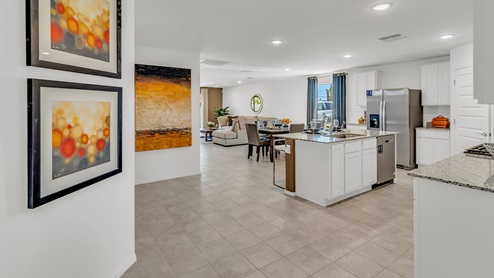 Welcome to Senita Crossing, a premier new home community by D.R. Horton, located in Tucson’s thriving southeast side. These thoughtfully crafted 3- and 4-bedroom new homes range from 1,200 to 2,200 square feet, providing the perfect blend of comfort and modern design. With easy access to I-10, Senita Crossing is conveniently situated near Davis-Monthan Air Force Base, the University of Arizona, and major employers like Raytheon, making it an ideal choice for families and professionals alike.  Each new home in Senita Crossing is designed with spacious living in mind, offering large, fully fenced backyards, covered patios, and inviting front porches. Inside, you’ll find elegant 12”x12” ceramic tile flooring throughout most areas, complemented by granite countertops and stylish Shaker cabinetry. Modern conveniences include stainless steel appliances such as a gas range, microwave, and dishwasher, all designed to enhance your daily living experience. Additionally, the Home is Connected® Smart Home package, which includes a smart thermostat, video doorbell, keyless entry, and more ensures that your home is as functional as it is beautiful.  Energy efficiency is a cornerstone of Senita Crossing’s new homes, which are DOE Zero Energy Ready. These homes feature tankless water heaters, LED lighting, and advanced spray foam insulation to ensure lower energy costs and a smaller carbon footprint, offering you a sustainable and cost-effective living environment. The community itself is designed with families in mind, featuring a park with a playground, a ramada, and a grassy common area, as well as a maintained bike and walking trail that connects to McCain Loop, providing ample opportunities for outdoor recreation.  Senita Crossing is located within the highly regarded Sunnyside Unified School District, offering access to top-rated schools such as Los Niños Elementary, Lauffer Middle School, and Desert View High School. For those seeking specialized education, the nearby Gallego Primary Fine Arts Magnet School is an excellent option for families. The community’s prime location ensures that you are never far from the essentials. With I-10 nearby, commuting is a breeze, and Tucson International Airport is just minutes away. Residents will also enjoy convenient access to shopping centers, local Carnecerias, and dining in some of the best restaurants in Tucson.  For those who appreciate outdoor activities and cultural attractions, Senita Crossing is just a short drive from Sabino Canyon, Reid Park Zoo, Tucson Botanical Gardens, and Kino Sports Complex. At Senita Crossing, D.R. Horton’s commitment to quality and innovative design is evident in every detail. Discover your ideal home in a community that offers everything you need to live your best life.